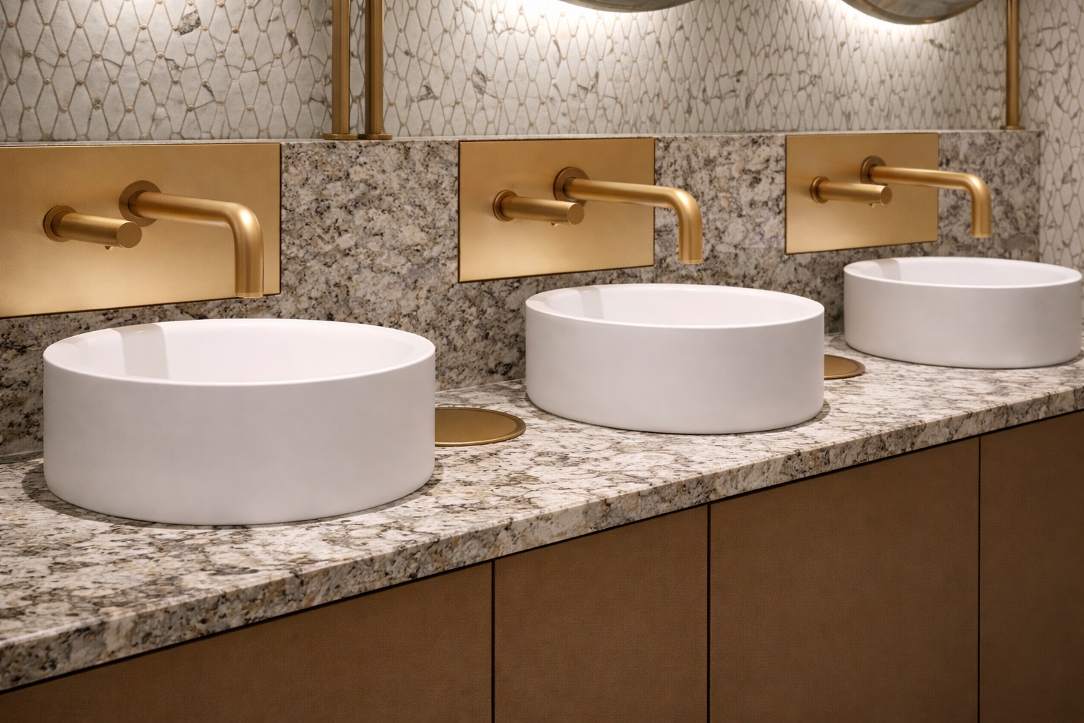 Airport restroom installation featuring BathSelect integrated soap dispenser faucets